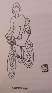 line drawing of woman on bicyle with small child behind her, with caption A common sight